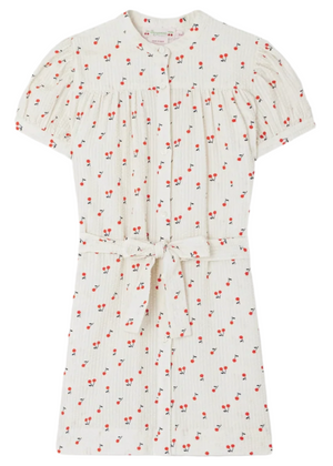 The Elorida Gathered Dress with Cherry Print by Bonpoint is a white cotton girls’ dress with playful cherries, button front, gathered shoulders, and a matching waist tie belt.