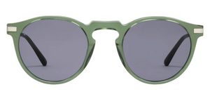 The Noto by Jimmy Fairly: round sunglasses with a green translucent acetate frame, dark lenses, and thin black arms shown on a white background. Lightweight for all-day comfort.