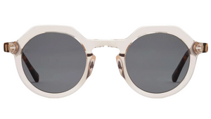 The Hometown by Jimmy Fairly: round sunglasses featuring a translucent beige cellulose acetate frame and dark lenses, displayed front view on a white background.