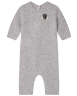 The Bonpoint Baby Boys' Tinoe All in One Outfit is a light gray, long-sleeved knit romper with snap buttons and a koala bear applique on the chest, shown laid flat on a white background.