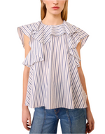 A woman wears the Ulla Johnson Amaia Top, a blue striped blouse with wide ruffled sleeves in soft cotton shirting, paired effortlessly with blue jeans.