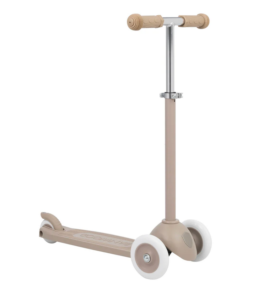 The Banwood Eco Scooter, a beige 3-wheel scooter from the Eco Collection made with recycled plastic, white wheels, and a metal handlebar, is angled on a plain white background.