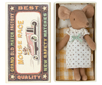 A charming Maileg Big Sister Mouse in a white nightgown with a green bow rests in an open matchbox. The box features prints of a vintage car and the words "Grand Old Match Factory" and "Mouse Race," adding nostalgic charm to this delightful keepsake.