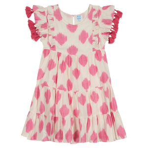 The Girls' Sophie Tassel Dress by Mer is a cream-colored, short-sleeve dress with pink polka dots, ruffled sleeves, a scoop neckline, tasseled accents, and a tiered twirly skirt.