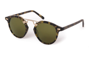 The Krewe St. Louis Tortuga 12K Sunglasses feature a rounded silhouette, green lenses, tortoiseshell frames, and a slim gold bridge—evoking classic style—shown on a white background.