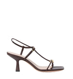 The Loeffler Randall Triana Mid Heel Sandal features brown nappa leather, thin straps, a small buckle, and a square toe, displayed in side profile against a white background.