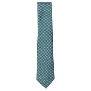 The Robert Jensen Torus Tie is a teal silk tie featuring a small repeating geometric pattern, handmade in Italy and shown against a white background.