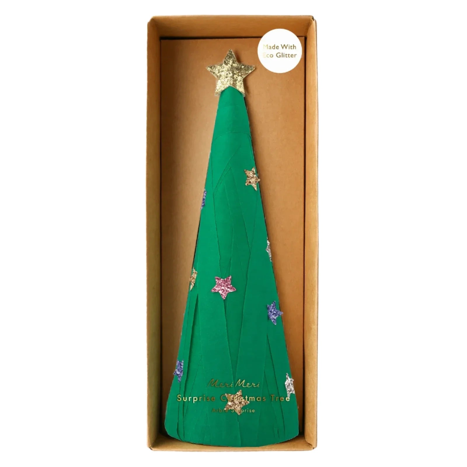 The Meri Meri Surprise Christmas Tree is a green paper cone adorned with glittery stars and a gold star topper, ideal for festive gifts. It comes packaged in a brown rectangular box.