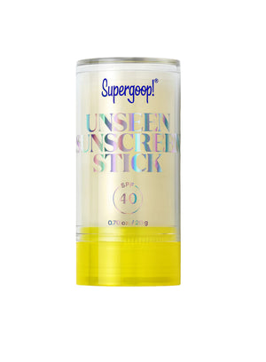 The Supergoop Unseen Sunscreen Stick SPF 40, shown with a clear swatch beside its yellow cap on a white background, offers invisible sun protection ideal for use even over makeup.