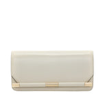 The Victoria Beckham 202 Clutch, a cream leather bag with gold accents and a smooth exterior, exudes vintage charm against a white background.