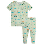 Magnetic Me's Baby Modal Pajama Short Sleeve Set in light green is made from eco-friendly TENCEL™ modal and showcases a playful golf-themed print with golfers, golf carts, trees, and flags.