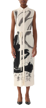 A person dons a sleeveless, collared ankle-length Pleated Shirtdress by Jason Wu Collection, showcasing an abstract black and gray design that accentuates its silhouette. Paired with black pointed shoes, the outfit exudes the feel of exclusive artwork.