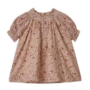 The Noralee Girls' Maddie Dress is a vintage-inspired, short-sleeved pink dress for babies, featuring a smocked neckline, delicate floral embroidery, and a loose fit, shown on a white background.