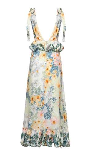 Introducing Agua By Aguabendita's Infinito Maxi Dress: a sleeveless floral print design with ruffled straps and hem, striking bows, and a deep V-back. This masterpiece features pastel fabric for an enchanting look.