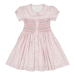 Explore the Antoinette Baby Girls' and Girls' Violette Floral Short Puff Smocked Dress. This chic pink summer dress features a Peter Pan collar, embroidered bodice details, and a button-down front for true French elegance.