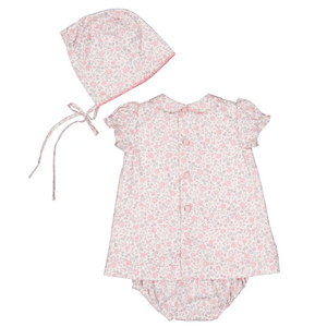 The Antoinette Baby Girls' Violette Floral Short Puff Baby Set radiates French charm with a white and pink dress, matching bonnet, and bloomers. The delicate floral pattern and back-buttoned design pair perfectly with chin ties on the bonnet for an adorable Easter outfit.