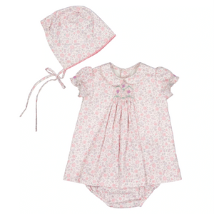 The Baby Girls' Violette Floral Short Puff Baby Set by Antoinette radiates French elegance, featuring a charming romper with a matching bonnet in pink and green floral designs, ideal for Easter. The ensemble is completed with a tied string on the bonnet for added charm.