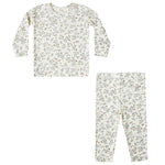 The Quincy Mae Baby Girls' and Girls' Bamboo Pajama Set is a two-piece slim-fit outfit with long sleeves and pants, featuring a white background with subtle green and red floral prints.
