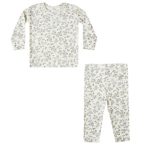 The Quincy Mae Baby Girls' and Girls' Bamboo Pajama Set is a two-piece slim-fit outfit with long sleeves and pants, featuring a white background with subtle green and red floral prints.