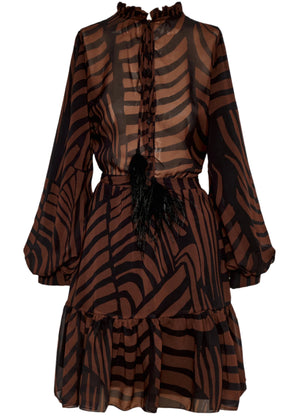 The Roa Mini Dress from Andres Otalora features a long-sleeve, A-line silhouette with ruffled neckline and hem, showcasing a brown and black abstract pattern enhanced by black feather detailing at the waist.