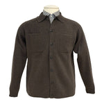 The Alan Paine Ashcroft Knit Polo is styled beneath a brown button-up shirt jacket with two chest pockets, shown on a mannequin for a sharp, modern look.