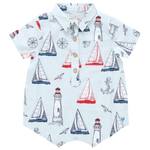 Set sail in the Pink Chicken Baby Boys' Easton Jumper—a collared short-sleeve romper decorated with playful sailboats, lighthouses, anchors, and compasses in vibrant red, blue, and white.