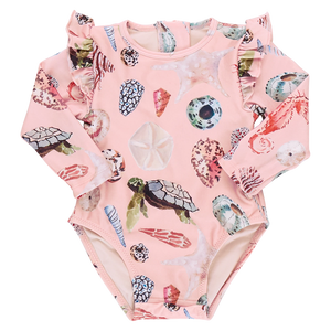 Explore the Mediterranean Baby Girls' Rachel Suit by Pink Chicken: a pink long-sleeve swimsuit with watercolor shells and sea life patterns, featuring charming ruffled shoulders from our Resort Collection.