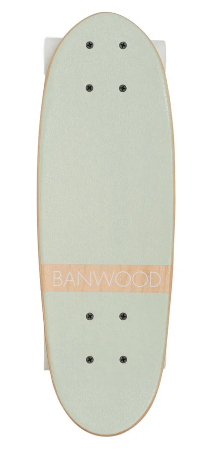 A top view of a Banwood skateboard deck in mint green, made from Canadian Maple, displays "BANWOOD" prominently in white text across the center.