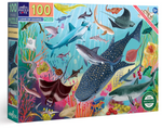 The Eeboo Love of Sharks 100 Piece Puzzle showcases various shark species and marine life in an underwater scene, including a full-color poster of these majestic creatures.