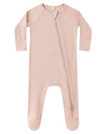 The Quincy Mae Baby Bamboo Zip Footie features a light pink color, long sleeves, footed legs, and an asymmetrical zipper running from neck to leg.