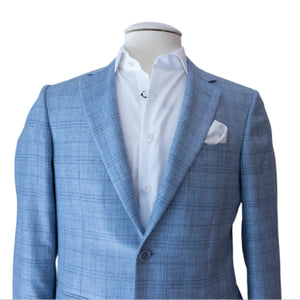 Canali's Sky Blue Fine Plaid Blazer and white dress shirt are displayed on a mannequin, showcasing a modern fit with an overcheck pattern and complemented by a crisp white pocket square.