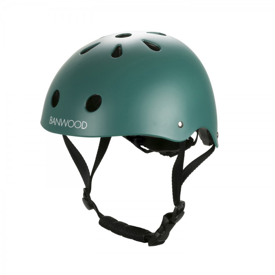 The Banwood Children's Helmet is a green ABS hard-shell helmet featuring ventilation holes, a dial fit adjustment system, and adjustable chin straps for a secure fit. "Banwood" is printed on the side.