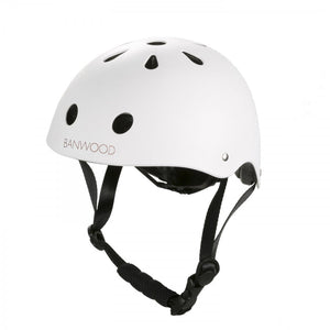 The Children's Helmet by Banwood is white with black ventilation holes, an adjustable chin strap, and a durable ABS hard-shell for reliable protection. Its sleek design features a convenient dial fit adjustment and stands out against a plain background.