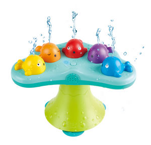 The Hape Musical Whale Fountain is a colorful plastic bath toy featuring musical whale figures that spout water from their heads, mounted on a green and blue base—perfect for fun bathtime play.