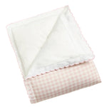 The Picnic Gingham Pink Toddler Duvet with Insert by Gooselings, featuring a folded pink checkered design with a white scalloped edge and backing, is an ideal baby gift to keep your little one snug and comfy.