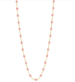 The Classic Gigi Necklace 19.7" by Gigi Clozeau showcases striking jewels of small pink beads evenly spaced on an 18-carat yellow gold chain.