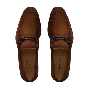 A pair of Magnanni Destin Cognac Suede men's contemporary loafers, featuring a braided strap detail, viewed from above.