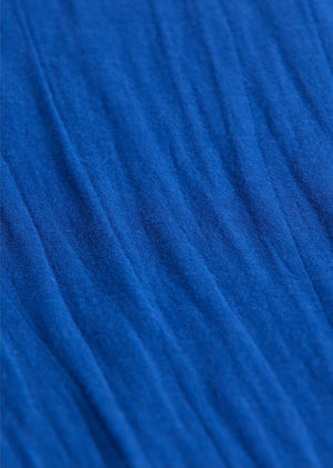 Close-up view of blue textured fabric with vertical wrinkles, featured in Arsene & Les Pipelettes Baby Girls' Fifi Bloomers.