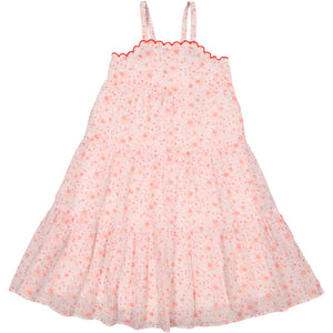 The Girls' Maria Dress by Louis Louise is a sleeveless pink floral dress with thin straps, a tiered skirt, and red scalloped trim along the neckline. Perfect for summer ceremonies, its romantic floral design adds elegance to any occasion.