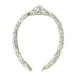 Rylee & Cru Knotted Headband in white with a subtle leaf pattern and top knot adds a stylish touch to any look; shown on a plain white background.