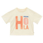 The Girls' Fauvette T-Shirt by Arsene & Les Pipelettes is cream-colored and organic, featuring "HOLA" in bold orange and blue letters on the front.