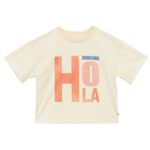 The Girls' Fauvette T-Shirt by Arsene & Les Pipelettes is cream-colored and organic, featuring "HOLA" in bold orange and blue letters on the front.