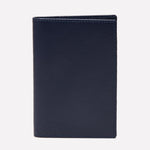 An upright Ettinger Capra Passport Case in closed, dark blue Capra leather is displayed against a plain white background.