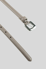 Close-up of the Gavazzeni Gloriosa Brushed Silver Buckle Belt, a thin, light gray hammered leather accessory, expertly crafted in Italy and shown against a plain gray background.