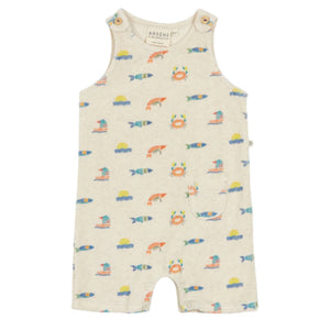 The Arsene & Les Pipelettes Baby Fedolin Terry Romper is beige with colorful fish, crab, and sailboat prints. This sleeveless romper features shoulder buttons and a small front pocket.
