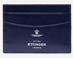 The Ettinger Capra Flat Credit Card Case is a minimalist navy goat leather card holder with multiple slots and white embossed branding on the front.
