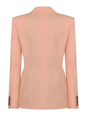 Flica Charmer Blazer by Blaze Milano is equestrian-inspired with a straight cut, peach hue, and buttoned cuffs, crafted from a luxurious silk-linen blend. View from the back.