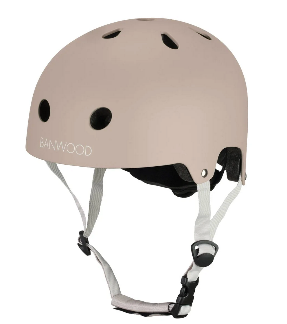 A beige Banwood Eco Helmet with ventilation holes, white adjustable straps, and a black buckle is shown against a white background.