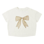Rylee & Cru’s Baby Girls' and Girls' Boxy Tee features a white short-sleeve design with a large gold ribbon bow graphic on the front and a classic crew neckline for a relaxed, boxy fit.