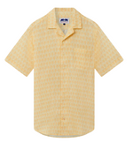 The Love Brand Arawak Linen Shirt combines elegance and versatility with a light yellow, short-sleeve, button-up design. It features a subtle palm tree pattern, stylish camp collar, front pocket, and engraved corozo nut buttons.